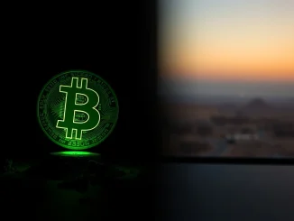 Bitcoin symbol glowing green amid geopolitical tension backdrop representing BTC price resilience.