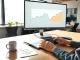 Analyst's desk with data charts comparing Cardano ADA, XRP, and Pepeto cryptocurrency price predictions for 2030.