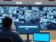AI video surveillance platform interface monitoring multiple security camera feeds in an operations center.