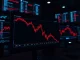 Digital chart showing a sharp crypto price crash leading to massive liquidations on major exchanges.