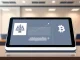 Daily cryptocurrency news summary showing key market developments for March 27, 2026 on a financial news desk tablet.