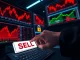 A hand executes a large crypto sell order as markets plunge, with the Pepeto token chart rising in the background.