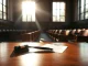 Empty courtroom with gavel representing withdrawn DeFi lawsuit against SEC.