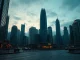 Hong Kong financial district skyline with digital currency symbols representing new stablecoin licenses.