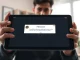 FBI token scam warning displayed on a Tron blockchain interface tablet screen.