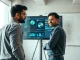 Founders in an Indian startup office discuss AI model development for the Google Accel accelerator.