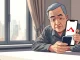 Hong Kong retiree targeted by crypto expert scam showing concern over smartphone.