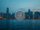 Hong Kong stablecoin regulation and digital finance innovation over city skyline.