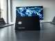 Kast stablecoin payment card on a desk with a world map showing expansion routes to North America, Latin America, and the Middle East.