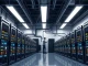 Interior of a US Bitcoin mining data center showing rows of ASIC hardware, related to the Mined in America Act.