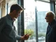 A father-son duo at a whiteboard mapping digital context for AI agents at startup Nyne.