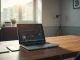 Laptop showing crypto charts and SEC, CFTC seals on desk in an office setting.