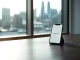 Revolut UK banking license announcement with smartphone displaying banking app in London office setting