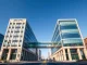 SEC and CFTC buildings connected by bridge symbolizing regulatory coordination and oversight
