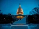 US Capitol at dusk with data tablet illustrating the Senate crypto bill and CLARITY Act debate.