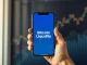 Smartphone displaying the new Threshold Bitcoin liquidity app interface, representing the 2026 DeFi launch.