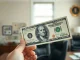 New $100 bill featuring Donald Trump's signature as part of historic currency redesign.