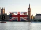 UK Parliament with cryptocurrency symbols representing the political donations ban