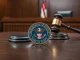 US Department of Justice seal with blockchain imagery representing the $3.4 million Tether forfeiture case.
