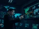 Law enforcement officer analyzing cryptocurrency transaction data linked to the $580M DOJ seizure from Chinese crime networks.