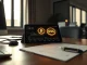 Analyst desk with tablet showing USDC and USDT transaction volume data charts.