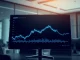Analyst examining XRP price chart showing symmetrical triangle pattern similar to 2017 setup.