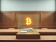 Bithumb's legal action to recover Bitcoin from a payout error in a South Korean courtroom.