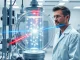 Caltech researcher in lab with neutral-atom quantum processor apparatus using optical tweezers.