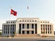 Cambodian government building representing the new crypto scam legislation passed by parliament.