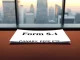 SEC filing document for the proposed Canary Capital PEPE ETF on a desk.