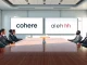 Cohere and Aleph Alpha merger announcement in a boardroom with executives discussing sovereign AI strategy.