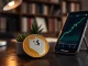 Dogecoin price prediction 2026: physical DOGE coin on desk with bullish chart on smartphone screen