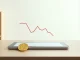 Genius Group Bitcoin treasury liquidation decision shown on a tablet with a physical coin.
