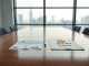 Documents representing Korea Investment & Securities and Coinone exchange on a boardroom table in Seoul.