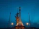SpaceX Falcon 9 rocket on launch pad ahead of historic IPO filing.