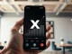 X app Cashtags feature showing live stock price chart on a smartphone screen, representing $1 billion in trading volume.