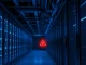 A compromised server in a data center with a red warning light, representing the Copy Fail Linux vulnerability.