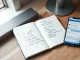 Notebook with AI terms being rewritten in simple language next to a smartphone showing an AI chat interface