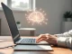 A person using a laptop with an AI neural network overlay, symbolizing the growing use and distrust of artificial intelligence tools.