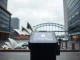 Futuristic payment terminal in Sydney with tokenized transaction display and Opera House in background