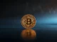 Bitcoin Cash price prediction 2026: BCH coin glowing on dark surface representing market analysis and future forecast.