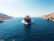 Oil tanker transiting the strategic Strait of Hormuz, a potential site for Bitcoin toll payments.