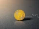 Bitcoin coin on dark surface with upward trend line, symbolizing price recovery to $100K