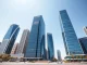 Abu Dhabi Global Market skyline on Al Maryah Island under clear daylight, representing the financial hub for BNY's crypto custody launch.