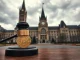 Canada advances bill to ban crypto political donations with Parliament building and gavel in foreground