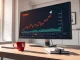 Financial analyst desk with Chainlink LINK price chart on monitor showing upward trend