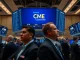 CME Group trading floor with screens showing crypto index futures for Bitcoin, Ether, Solana and XRP
