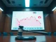 Courtroom with gavel and digital screen showing Bitcoin chart and Coinbase logo, representing legal and crypto news