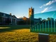 Dartmouth College campus with Baker Tower and financial data display representing crypto ETF investment