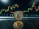 Dogecoin token on reflective surface with blurred financial charts in background